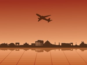 Plane flying over the city Backgrounds
